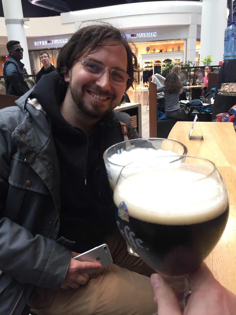 stadolf's tweet image. After a rainy sightseeing tour in #antwerp we’re enjoying the last Belgian beer at the BRU airport. With @dbrumann after the #phpbnl19 . My bag ist full of chocolate 😋