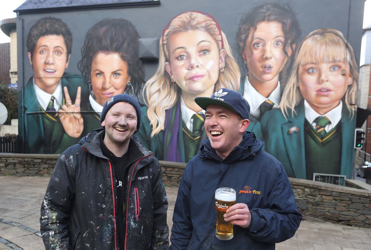 lorcanphoto's tweet image. A well deserved pint - The superb @uvartscic finish the Derry Girls mural at Badger's Bar, Orchard Street, Derry.