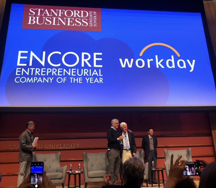 Workday's tweet photo. Our co-founders Dave Duffield and @aneelb accepting the Entrepreneurial Company of the Year (ENCORE) award. Thank you @StanfordGSB for the honor! https://t.co/4gdAKJvGH5
