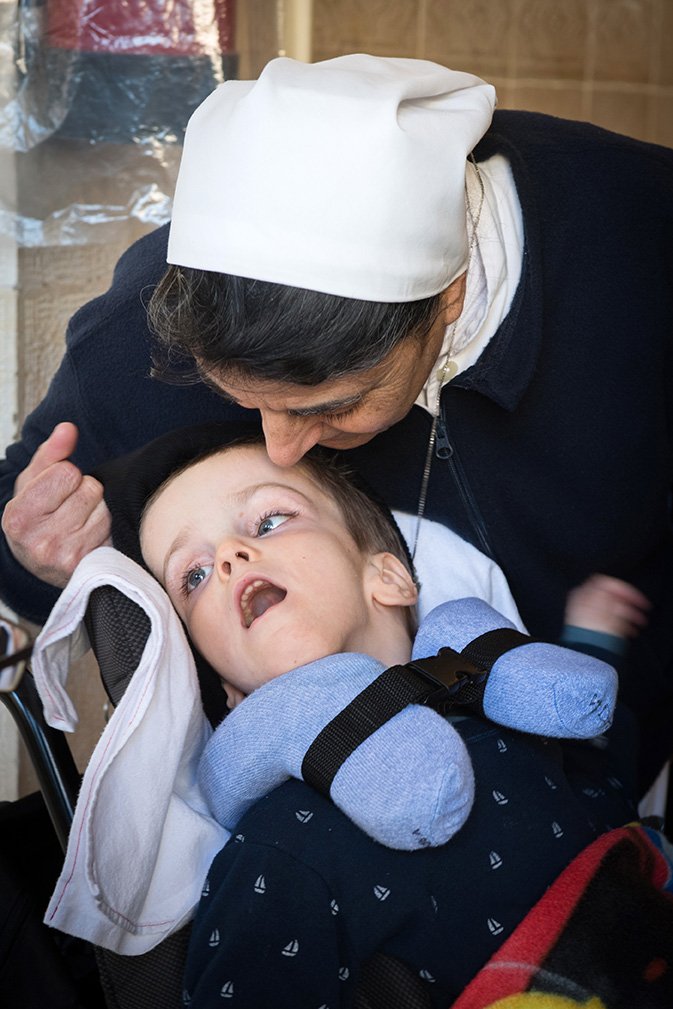 catholicEW's tweet photo. #picturesoftheday Inspirational example of Religious sisters in their care for disabled children at the Maison du Sacre Coeur in Haifa #hlc19 https://t.co/agOb2Bcim3