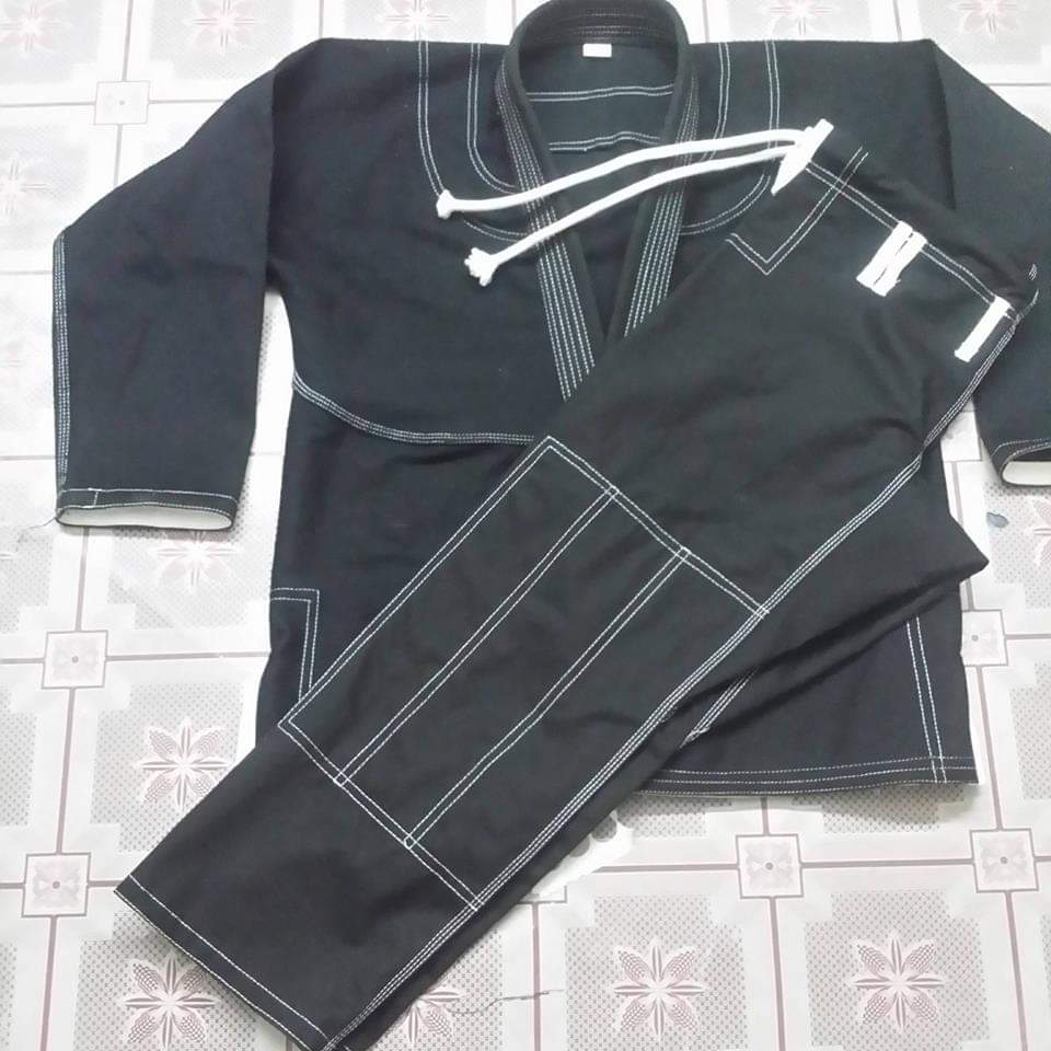 BJJ GI made black color with white stitching.