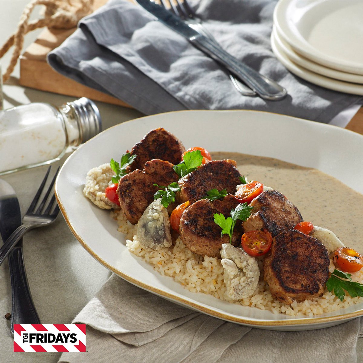 TGIFridaysPH's tweet photo. Here's something worth sharing over - pork tenderloins in truffle cream sauce over garlic rice. If you crave it, come have it at #TGIFridaysPH. https://t.co/559717B6gu