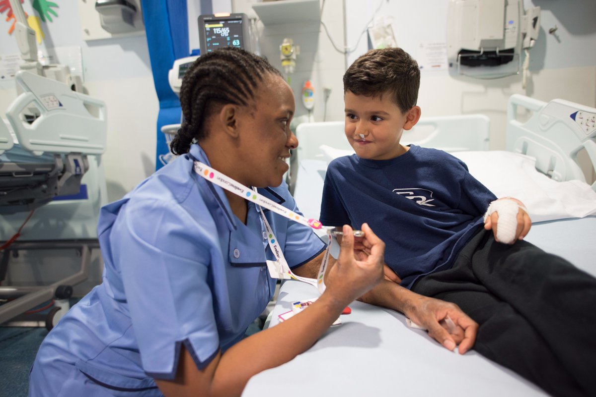 A nursing talking to a young patient