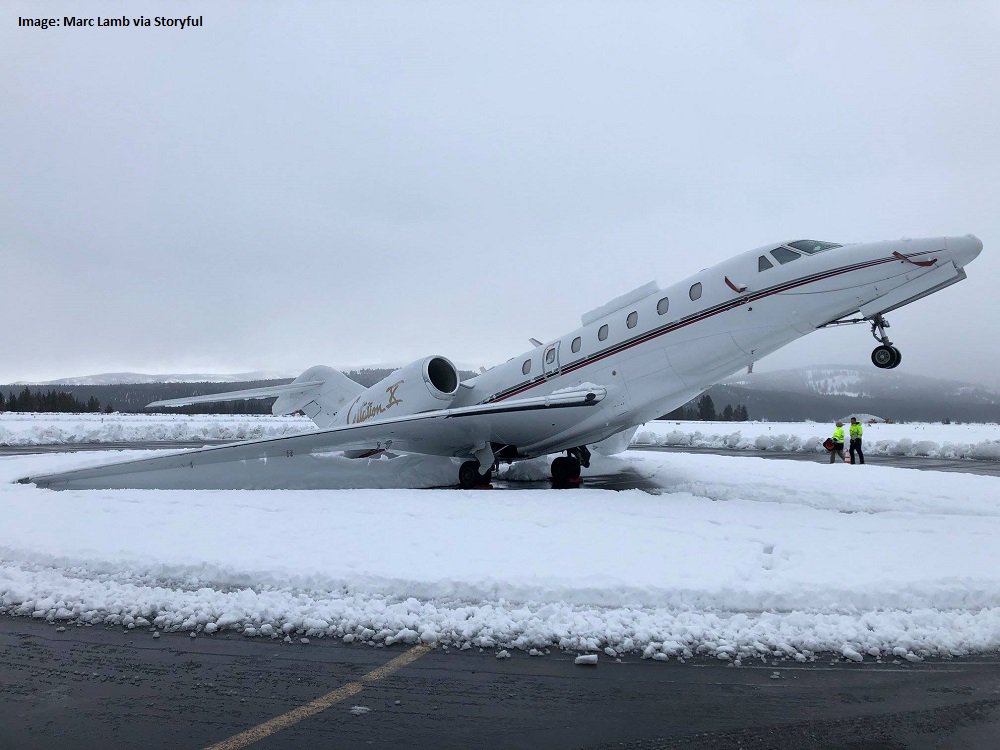 IN PHOTOS: Heavy #SierraCement snow weighs down the tail of a plane in Truckee Tahoe Airport