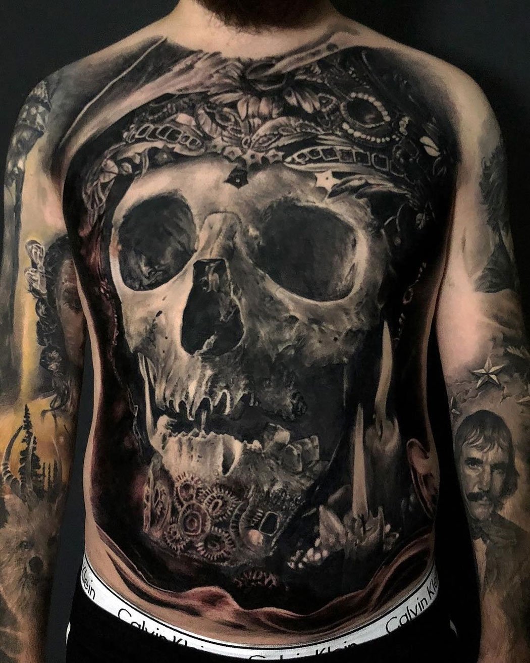 Black And Grey Skull Tattoo On Back Leg