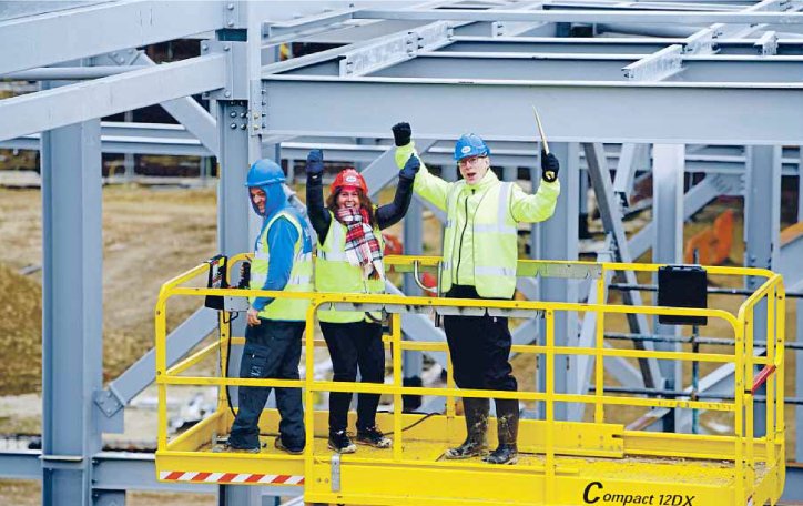 ROK_Group's tweet photo. Latest News! The New Les Quennevais School project hit a major milestone yesterday when the final piece of steel was added to the building’s frame by deputy head Paul Letch and head teacher, Sarah Hague. 👷🏼‍♀️👏#buildingthefuture #LesQuennevaisSchool #new #teamrok @LesQuennevaisSc https://t.co/28rZyXrnif