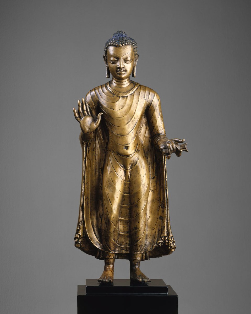 Standing Bronze #Buddha from #GuptaEmpire.

Date: late 6th–early 7th century.
Origin: Bihar, India.
Medium: Bronze.
Dimensions: H. 18 1/2 in. (47 cm); W. 6 1/8 in. (15.6 cm); D. 5 5/8 in. (14.3 cm)
Classification: Sculpture
Now in the MET Museum.