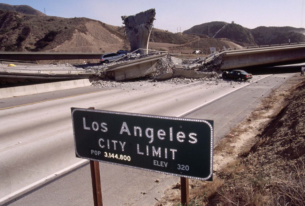 collapsed freeway overpass at the l.a. city limit after the northridge earthquake