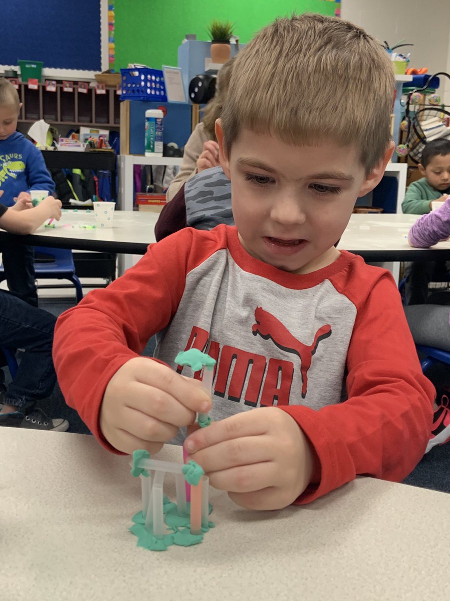 After some fine motor work softening clay with our hands, we added straws to build structures. #riveraprek