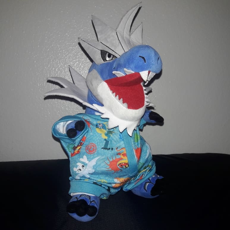GFanactic911's tweet photo. They had these really cute pajamas too &amp; unfortunately they ripped trying to get it on the #LightFury but I found use for it. 😅😊 He may not look like a dragon, but he's a dragon type so it works. 🤣 👌🏼👍🏼#Pokemon #Tyrantrum #ShinyTyrantrum #Plushies #HTTYD #HowToTrainYourDragon https://t.co/OIf0JOW64m