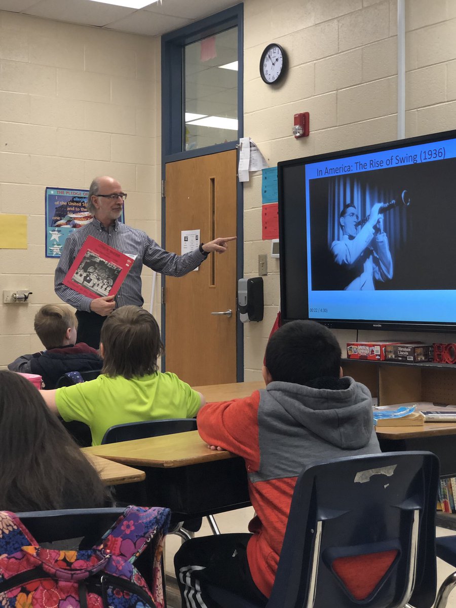 Evan Lee from Ga. Council of the Arts presenting “primary sources”  with 4th grade students learning about WWII. They were absorbed in compare/contrast of music, swing dancing, posters, letters etc., between the US &amp;Germany and how WWII effected the work force. #TCEStweets