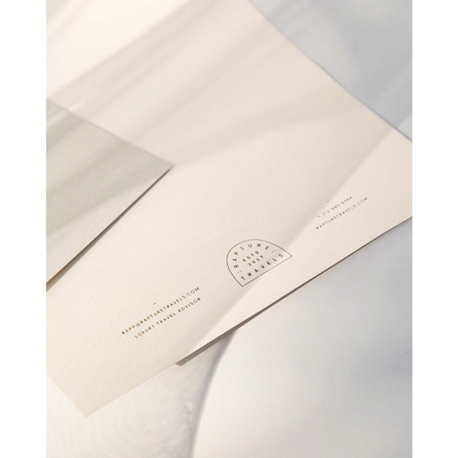 Black gloss foil letterhead on Colorplan Mist for Rapture Travels, designed by <a href="/AmberLouiseAsay/">Amber Asay</a> and printed by <a href="/goldimage/">Gold Image Printing</a>.
