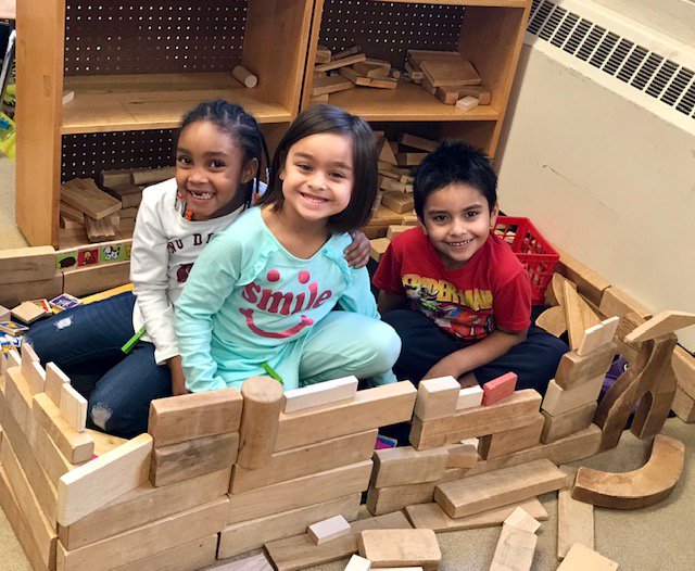 Kindergarteners building a house during play!