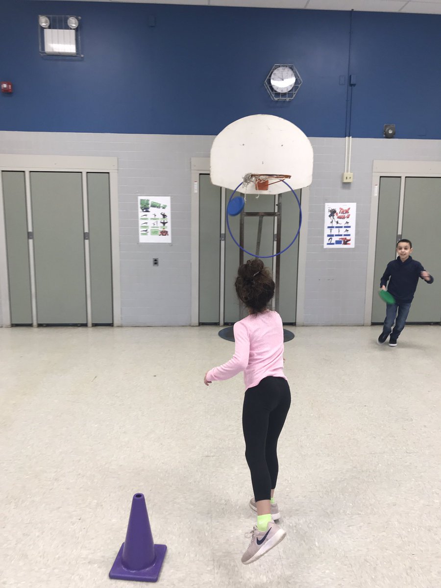 MrTrezzaMiddPe's tweet photo. Working on throwing frisbees at stationary targets hanging from basketball hoops. @MTPSpride #mtpsPride @MVS_Principal #snow https://t.co/W62h4p32O8
