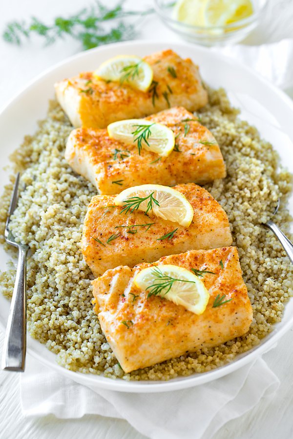 Healthy &amp; quick-to-prepare recipe, ready in under 20! Baked Halibut marinated in olive oil, lemon, garlic and paprika, finished with fresh dill...so tasty! thecozyapron.com/baked-halibut/