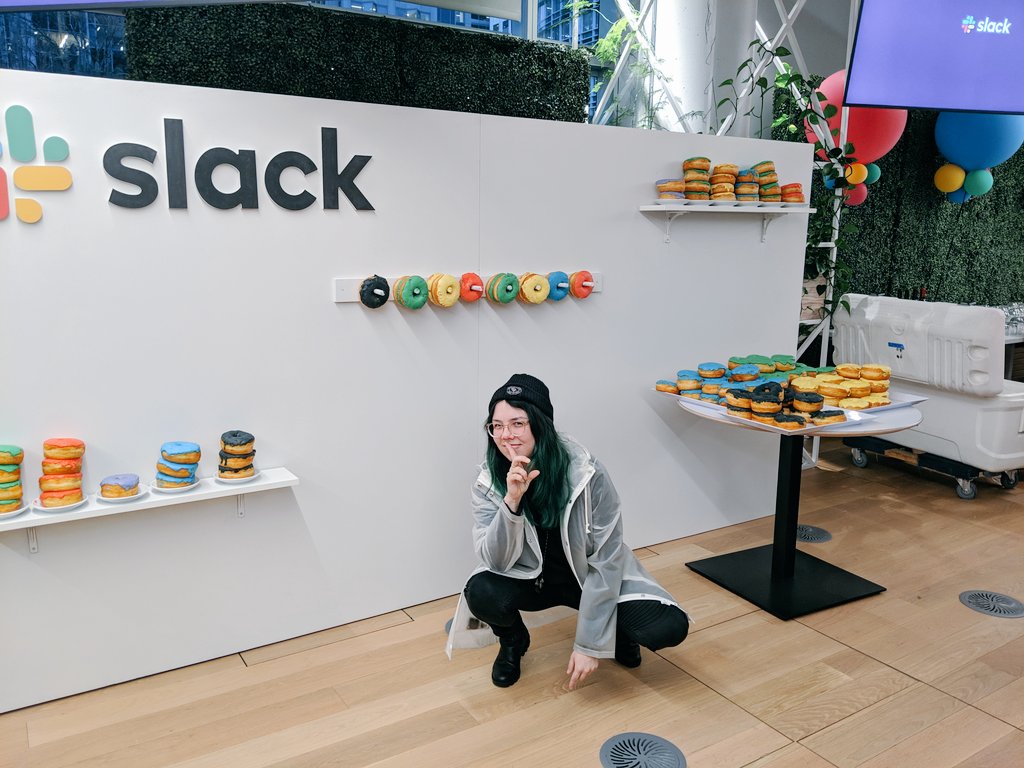 i can't sleep so here's me in front of a branded??? donut wall?????? happy rebrand everybody