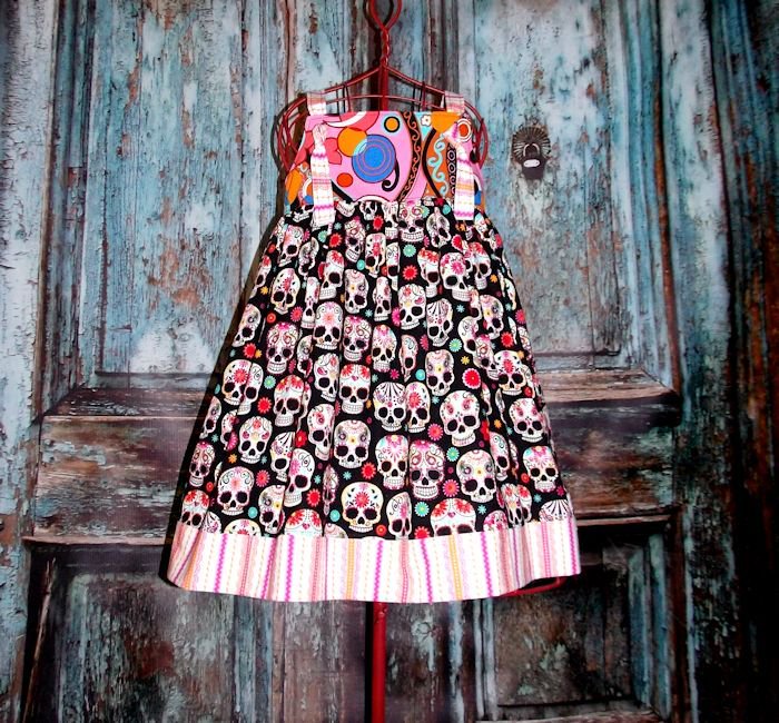 Thats_So_Addie's tweet photo. Sugar Skulls are always a bright and fun change to all the pink and frills out there. https://t.co/Z1Qa3tpROo #madetoorder #customsizes #gypsyspoonful #thatssoaddie #sugarskulls #DiaDeLosInocentes #dayofthedead #celebrations #madeinusa #skulls #knotdress #handmade #handcrafted https://t.co/cj1o9vRarn