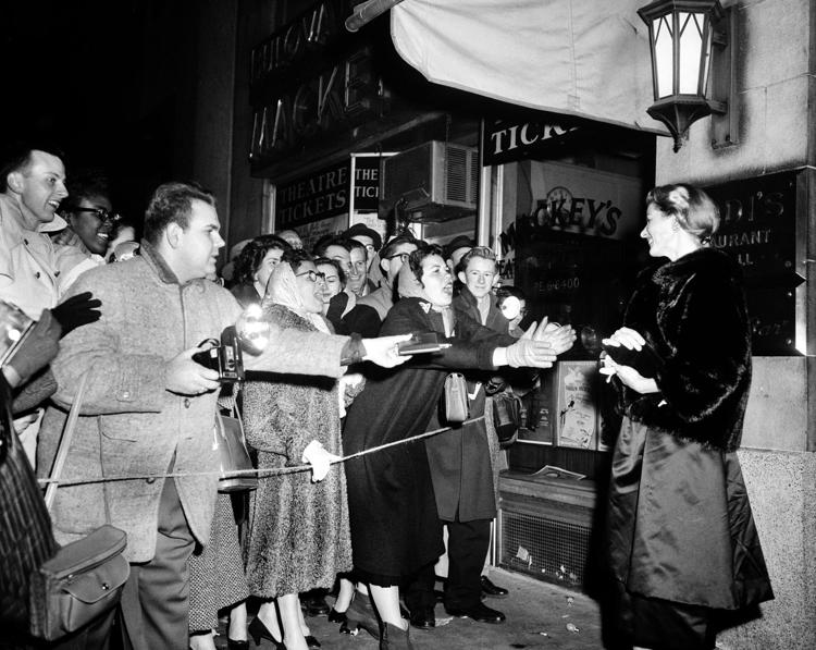 Ingrid Bergman leaving Sardi's restaurant in New York City on this date January 20 in 1957. Photo by Marty Lederhandler.