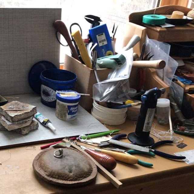 Annacia9's tweet photo. This is my bench where I make all my jewelry! I keep adding new tools and techniques but for the most part I use hand tools and elbow grease to finish my pieces, my New Years resolution for this year might need to be smarter not harder...#stullerbenchpro #fixmybench #handmadejewe https://t.co/Kz70PwbOF9