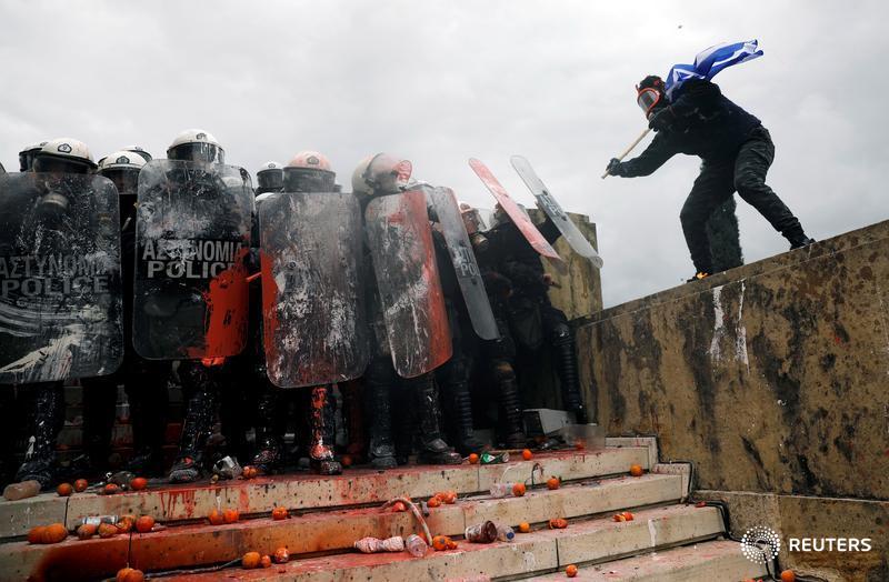 A protester approaches police during a demonstration in Athens ahead of next week’s parliamentary vote to ratify a name deal with Macedonia, and more photos of the day: https://reut.rs/2REIkxv 📷 Alkis Konstantinidis