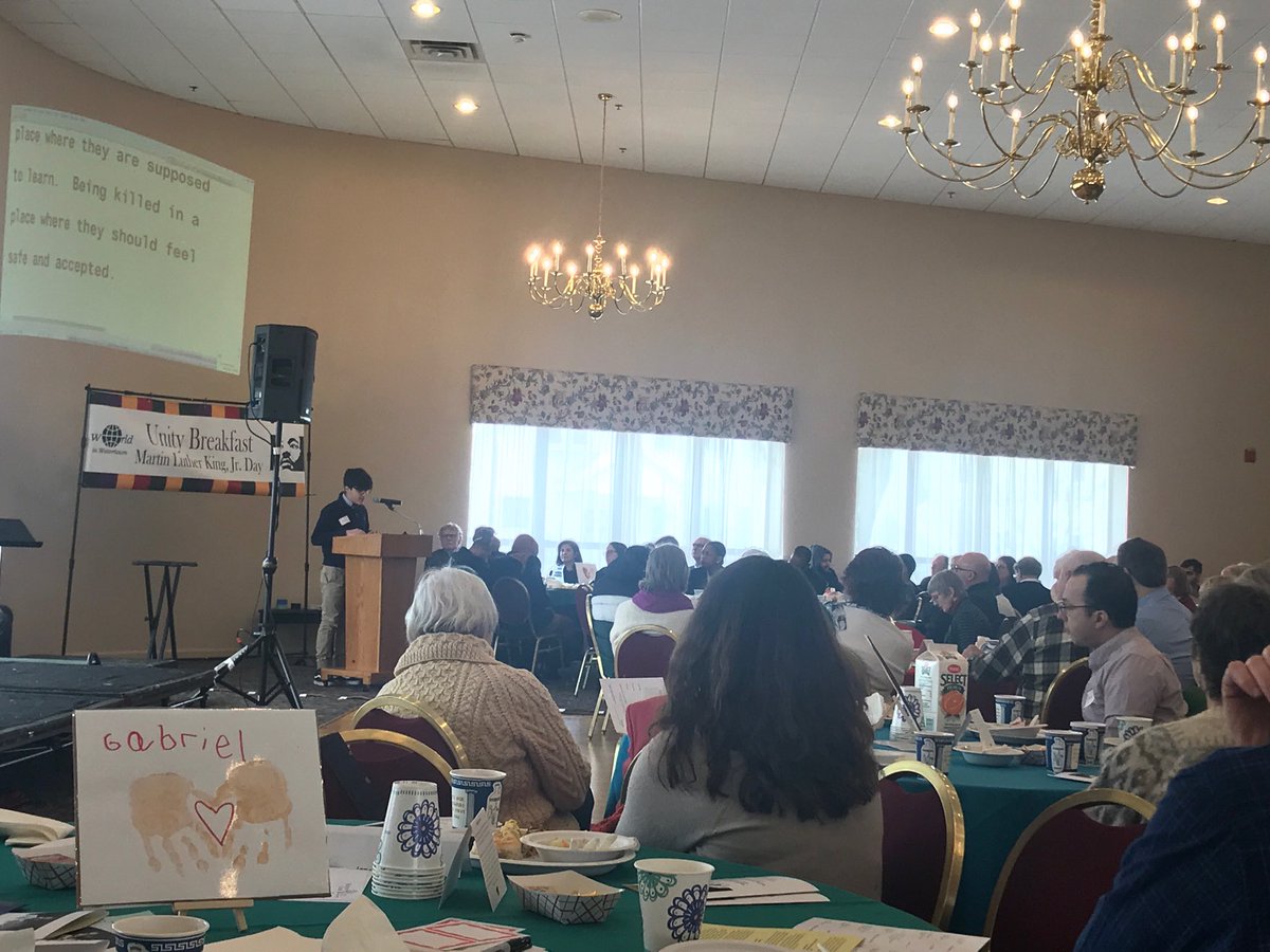 PrincipalofWMS's tweet photo. 8th grader Tino reading his essay at the 19th Annual Unity Breakfast for Martin Luther King, Jr. Day. Such a moving event! #wmspride #watertownpride β¦@WatertownSuptβ© https://t.co/CN2c278YfB