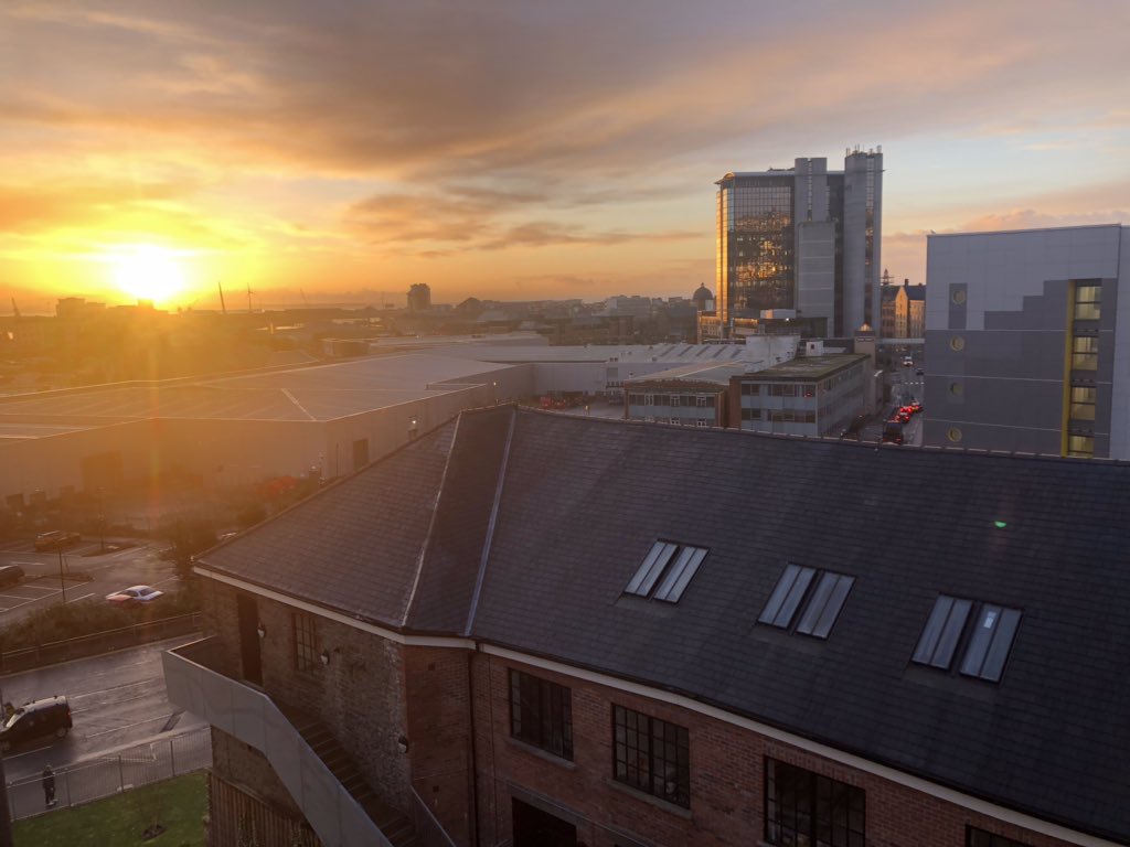 VisitDigital's tweet image. Sun coming up over #Swansea city from @TechHubSwansea
