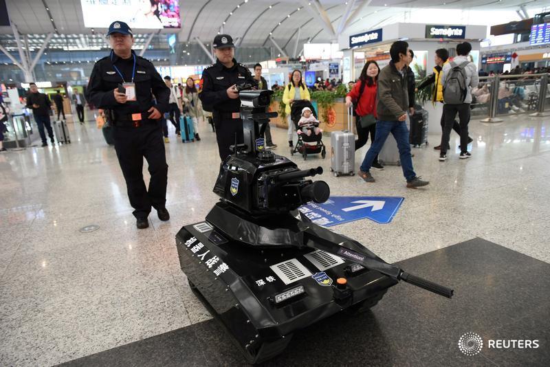Police operate a security robot inside a railway station as the annual Spring Festival travel rush starts in Shenzhen, China, and more photos of the day: http://reut.rs/2sFhW7O