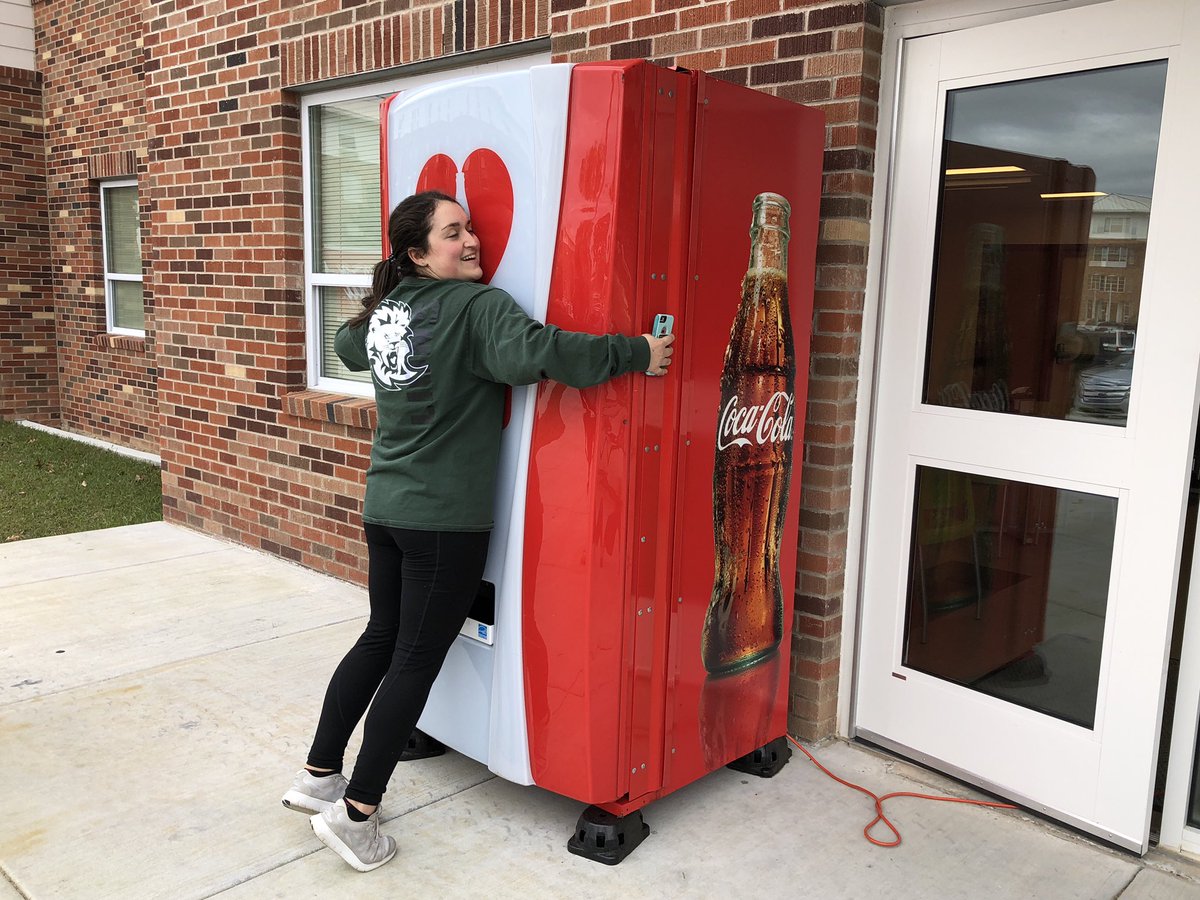 oursoutheastern's tweet photo. Give a hug, get a free Coke at @slucampusdining Back to School Party - plus games and prizes. It’s #HappeningNow until 4 pm at Ascension Market! #WinterWelcome #hugmeCoke https://t.co/C9BRpx8EL1