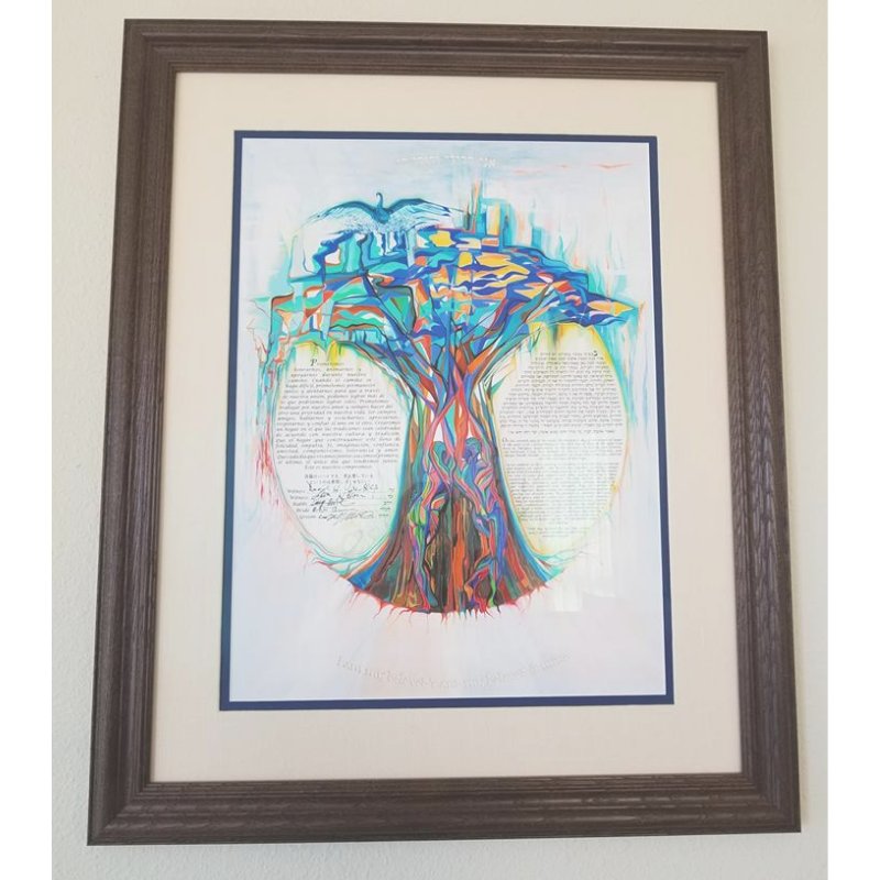 Sheyla sent us photos from her wedding (stay tuned!) AND of her Rainbow Tree Papercut Ketubah in her newlywed home. They were able to have 4 languages on the ketubah - English, Hebrew, Spanish and Japanese! How special? 
📜 <a href="/navashoham/">Nava Shoham</a>