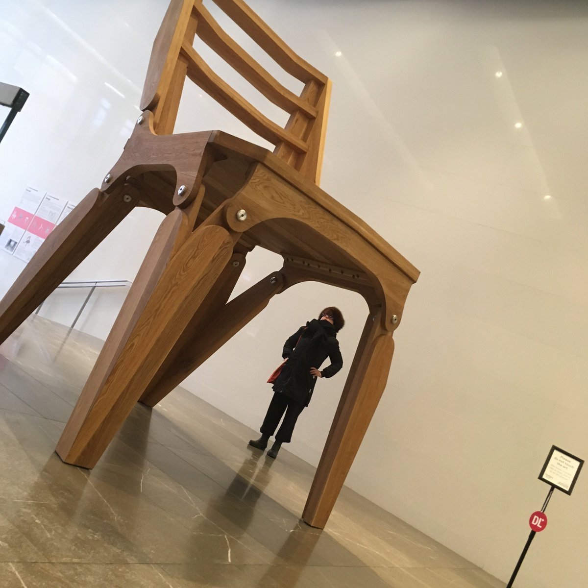 Trustcate's tweet image. Two wooden chairs, one big/one small, by @dwa_arc are meant to be a parable about conversations and finding common ground btw differing POVs. The roping off of the little one wasn't planned, but adds another metaphoric layer. #DesignTO #DesignTO19 On view 351 King St E #toronto