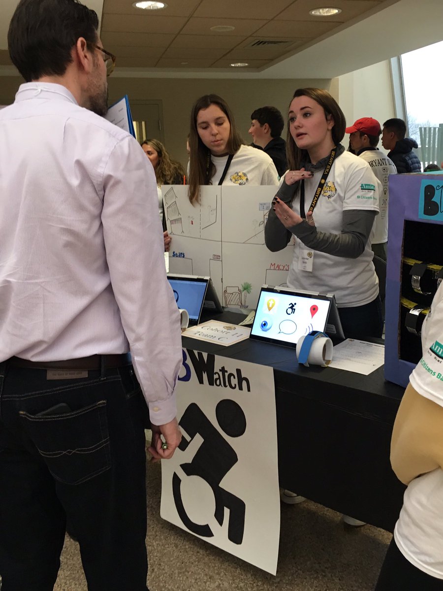 BryantUniv_News's tweet image. Wow. Cohort 11, Team C developed a smart watch that can help people with disabilities more independently navigate and communicate while shopping.  Here they are pitching to the judge. #tellittothejudge #BryantIDEA2019