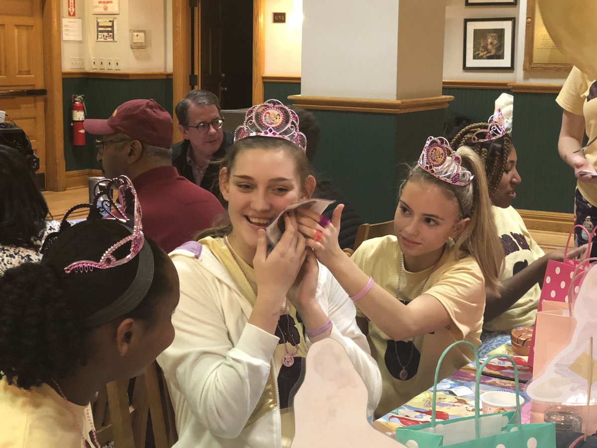 SIWolfpackBKG's tweet image. Is Senior Niki McDonald bleeding? Nope, Senior Molly Gannon helping a sister out with a temporary princess tattoo! #helpasisterout #teamwork #wolfpackbasketball #princessthemed #SeniorNight