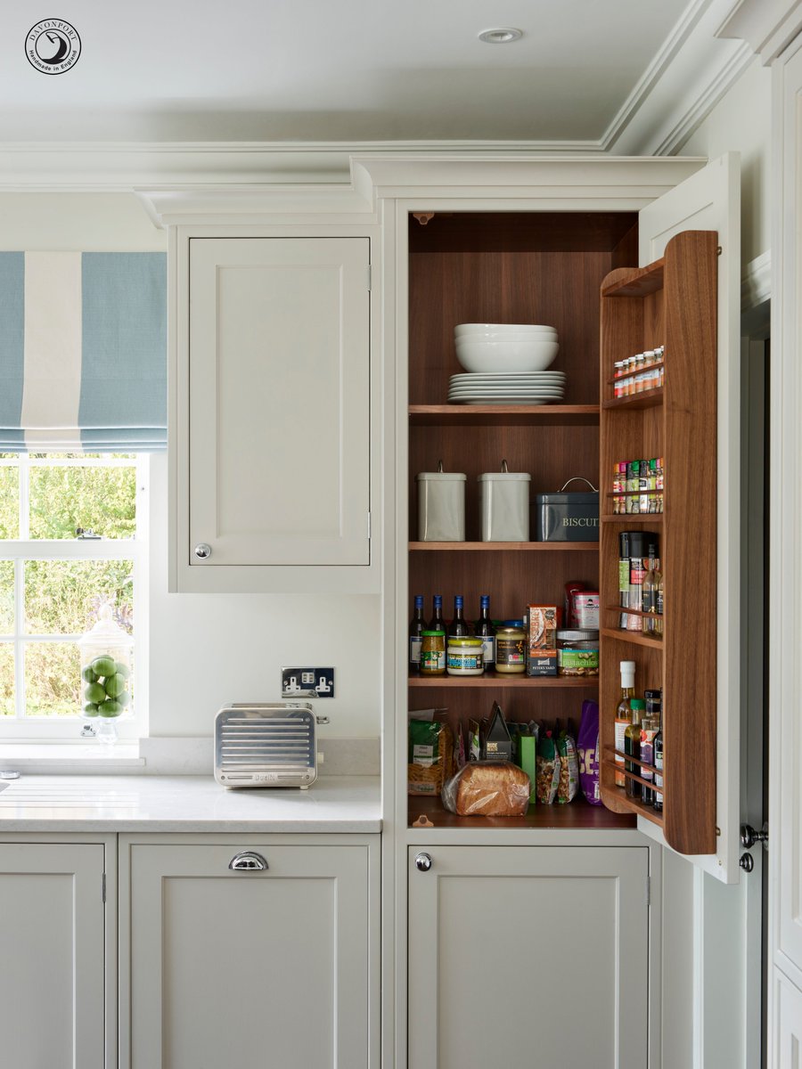 In a busy family kitchen every inch should be optimised for maximum storage. These walnut spice racks keep herbs, spices and oils within easy reach – using up otherwise wasted space in the design. #kitchendesign #kitchen #storage #kitchenstorage