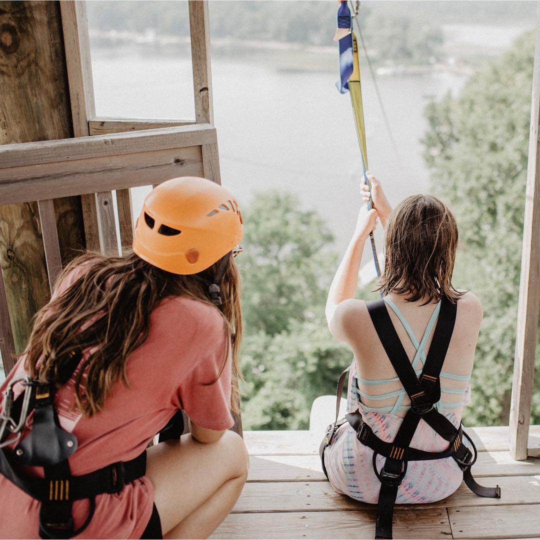YoungLife's tweet photo. “Friends like this show us who Jesus is and what He is doing: coming to us right where we are. This is Kelly helping her friend go down the zip line for the 7th time of the week, giving us a look into how Jesus sees us right where we are in fear and joy. He meets us there.” https://t.co/w5kkX8lYkP