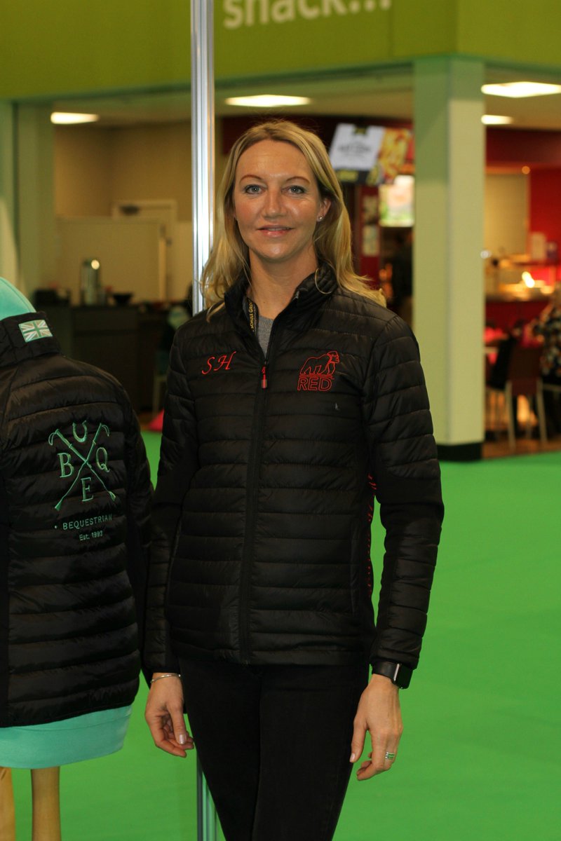 B_Equine's tweet photo. The lovely Sharon Hunt visiting our stand at BETA this week. Looking fabulous in the jacket we produced for Red Gorilla :)

#BETAInt19 https://t.co/b1hXdkJ7Es