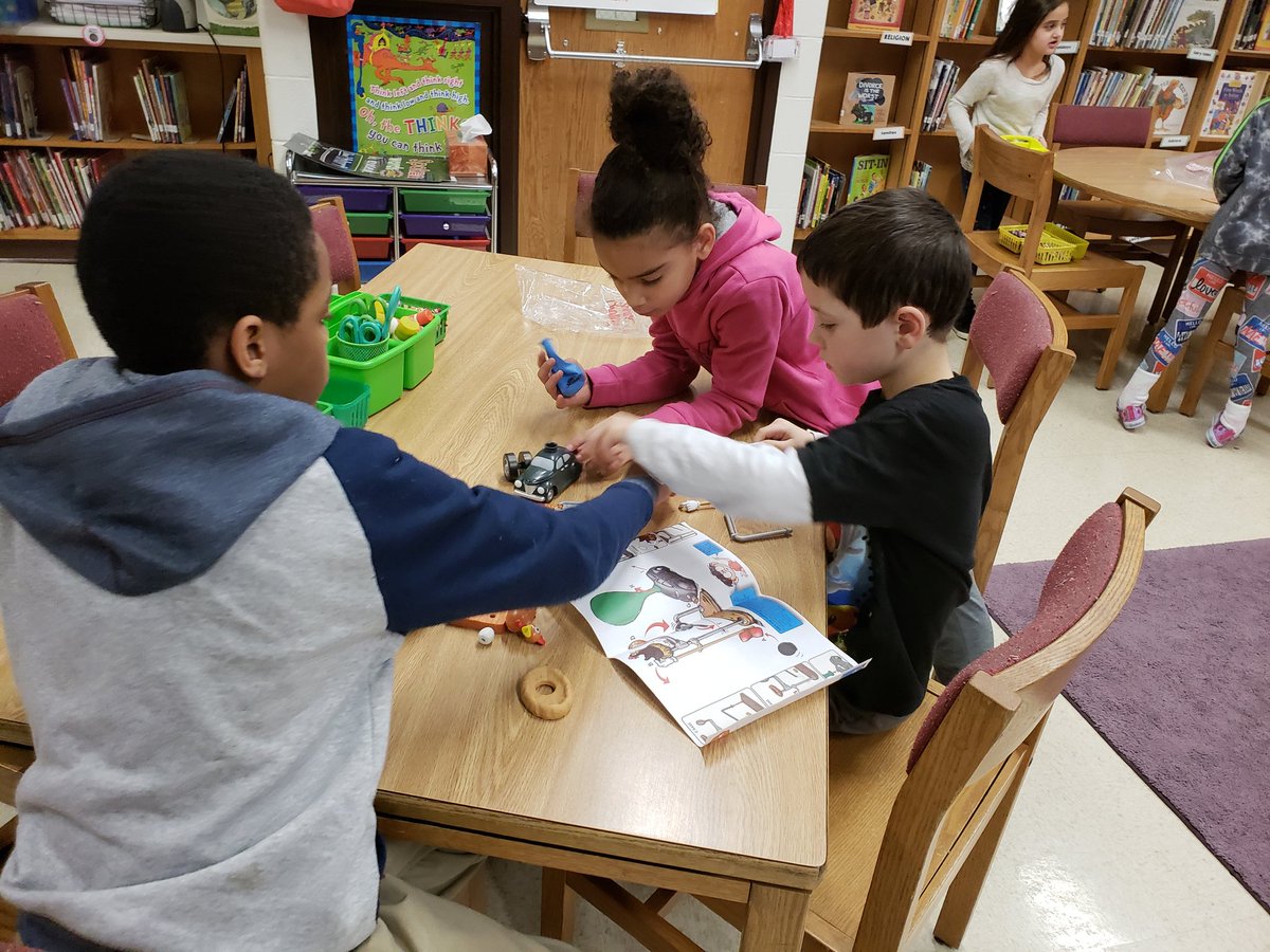 SOESlibrarylady's tweet photo. Seconds are LOVING working collaboratively & #problemsolving to create #RubeGoldbergMachines for #SOESmakerThursday in #library after reading "Rube Goldberg and the Simple Normal Humdrum School Day"! #bcpslms #makerspace #youngmakersatwork @FortkampBre @SevenOaksOwls https://t.co/kcDETBhE4r