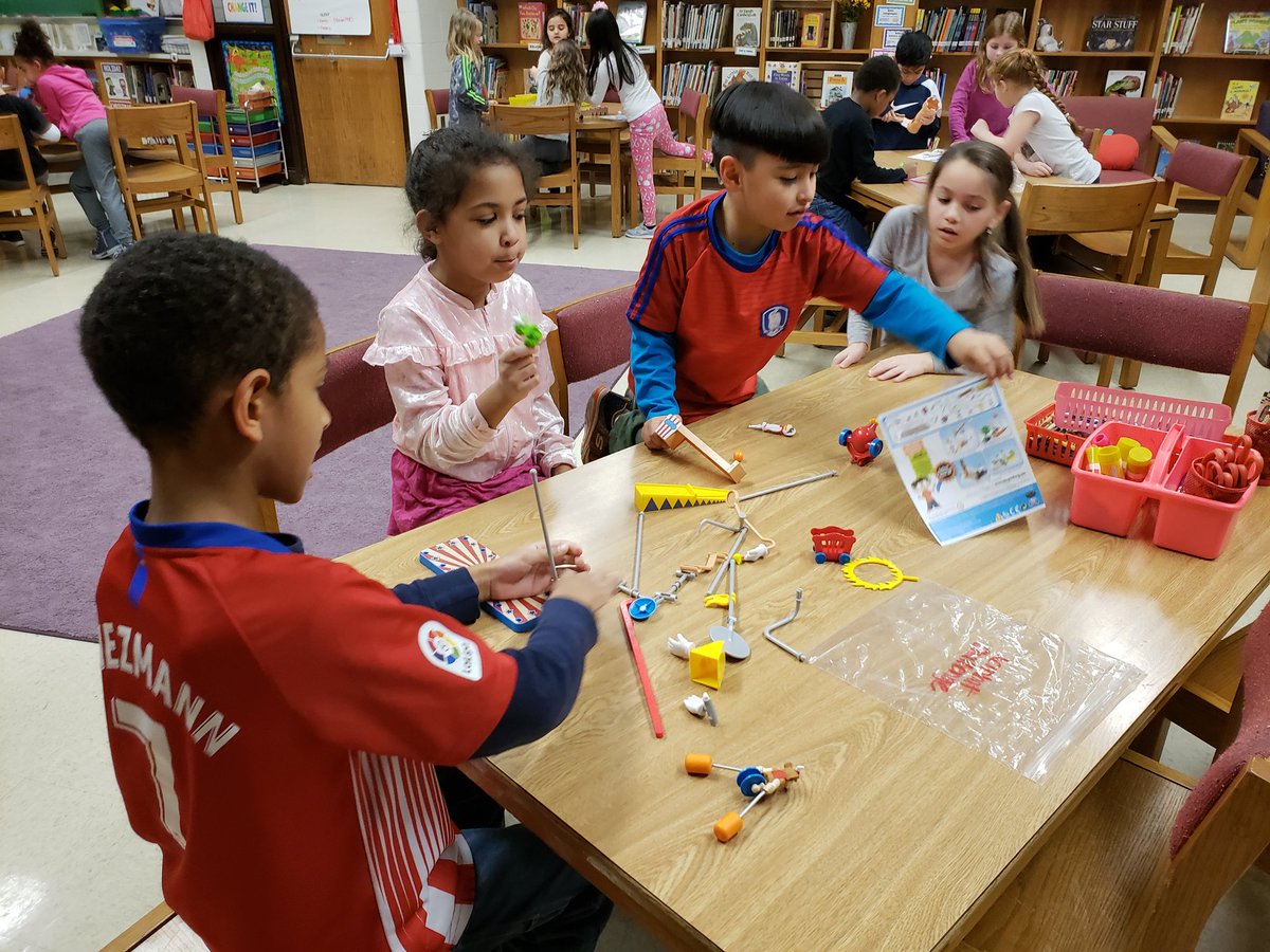 SOESlibrarylady's tweet photo. Seconds are LOVING working collaboratively & #problemsolving to create #RubeGoldbergMachines for #SOESmakerThursday in #library after reading "Rube Goldberg and the Simple Normal Humdrum School Day"! #bcpslms #makerspace #youngmakersatwork @FortkampBre @SevenOaksOwls https://t.co/kcDETBhE4r
