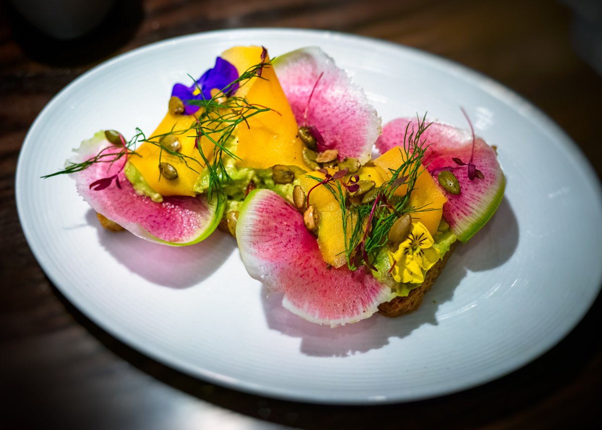 With pickled butternut squash, watermelon radish, fennel fronds, and chili pepitas, our Avocado Toast is a brunch favorite!