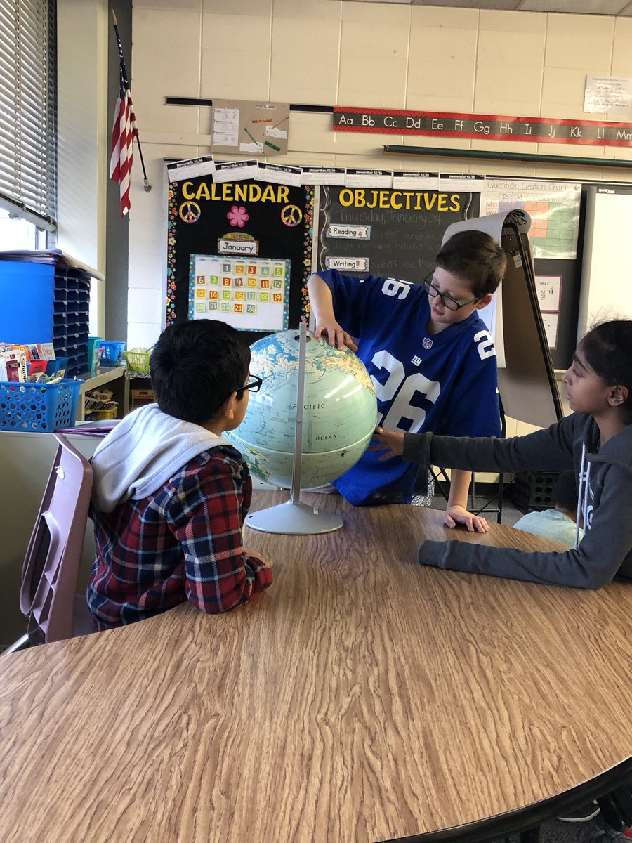 Caught these students spending their rainy day recess showing each other where their relatives immigrated from!