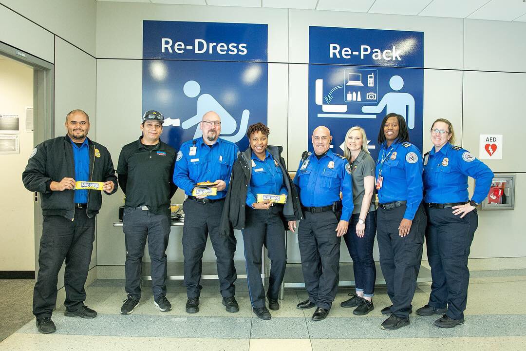 Blue_Goose's tweet photo. Day 34 of the government shut down. What can we do to help? Feed 50 TSA agents! After some clearance and a good ole pat down from our friendly agents {it’s ok, we brought more than 3 oz of liquid}, we hooked them up with a Blue Goose lunch! Thanks for keeping us safe! @TSA https://t.co/7iEJcjTzbs