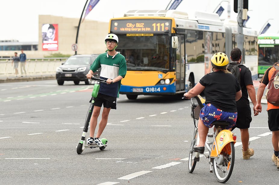 Griffith_Uni's tweet photo. Early popularity of shared e-scooters suggests they can be a valuable part of the mix for Brisbane #transport options. Transformative for travel, #GriffithUni researchers discuss their view on the Brisbane trial and its implications.  https://t.co/54NDX2TZRq @ConversationEDU https://t.co/DDeEiVkl8y