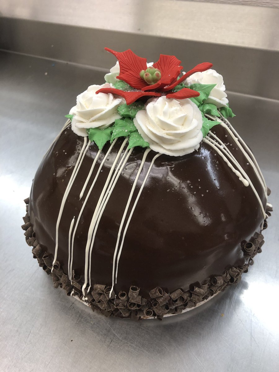 gal_cake's tweet photo. Oversized Raspberry bombe #cake with #buttercream roses and gumpaste poinsettia. I brought this to my family Christmas party it went over well 😉 https://t.co/5FGIvCAEi3