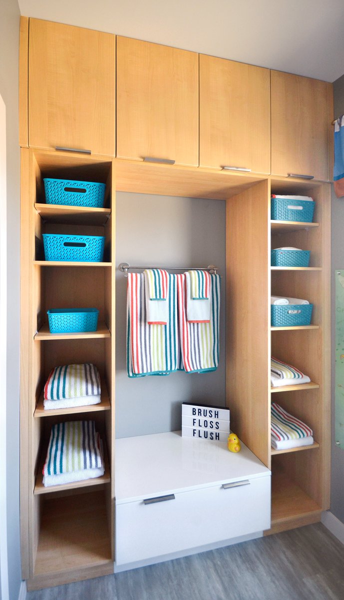 #Remodeling a #bathroom for #kids? Adding easy-access #storage is the perfect solution. Check out this bathroom by @UrbanEffectsWPG with plenty of cubbies and a terrific bench for little ones with extra built-in storage. Wow! urbaneffectsshowroom.com #bathroomdesign
