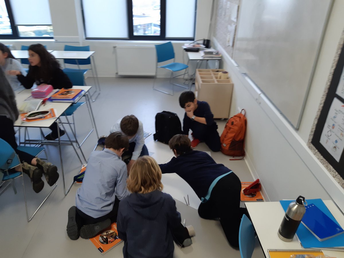 Year 7 Geography working on "Rivers: Risks and Risk Reduction" models.