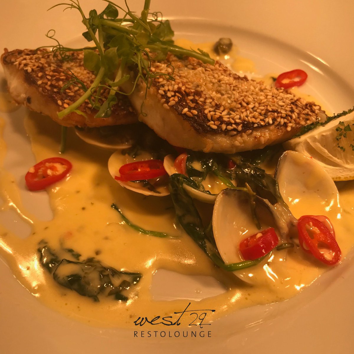 Sesame Crusted Seabass Fillet / clams chili spinach, lemon caper sauce! #Foodie #Yummo west29.ie