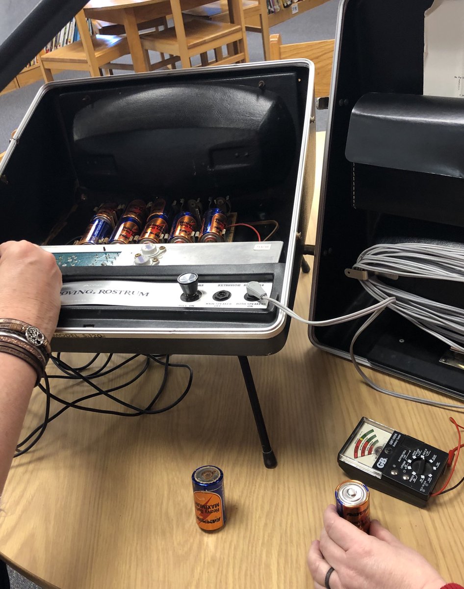 So happy that educators are innately pack rats!!! What a find, a 1960 portable PA system. Media Specialist, Julie Thompson and assistant, Tricia Rogers tinkering with the 10, D batteries trying to start it up. #TCEStweets