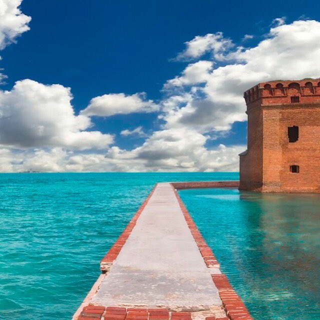 Interior's tweet photo. Bright turquoise waters &amp; the red brick walls of historic Fort Jefferson make a stunning scene @DryTortugasNPS. Pic by Jose Torres #Florida #FindYourPark https://t.co/7xlpIli8nn
