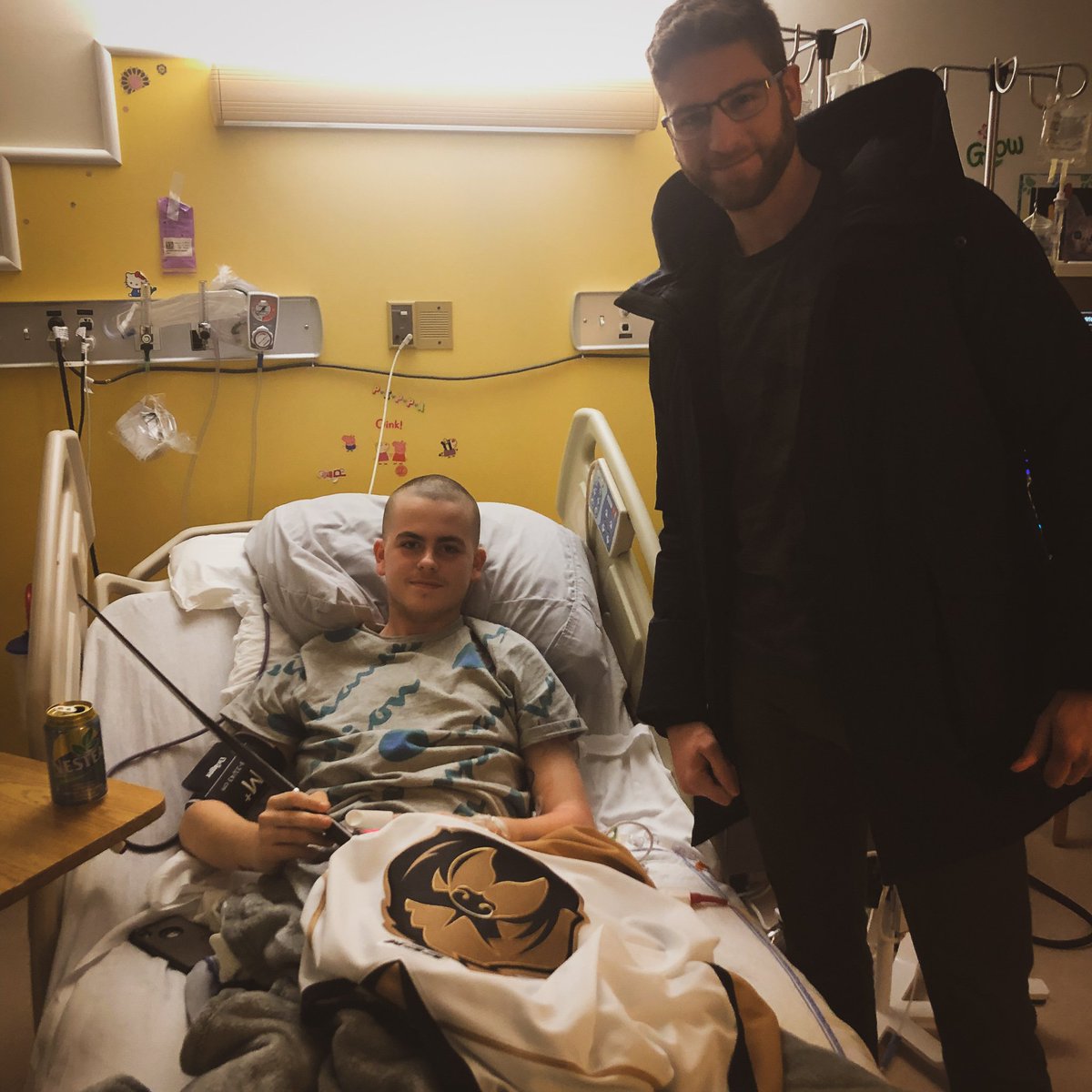 NLGrowlers's tweet photo. Today @Eamonthegoalie visited @HSFalconHockey Goalie Logan Millard to present him with Growlers Swag and just talk hockey.

Logan is battling Lymphoma but The Growlers and the entire goalie community  got his back 👊

#29LoganMillard | #WhateverItTakes https://t.co/y0QKf071Fc