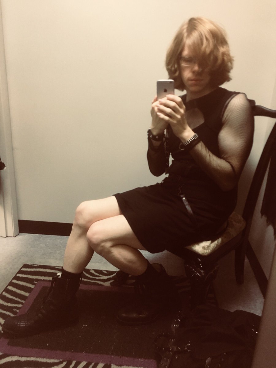 A bit nervous about posting it, but I tried on a neat gothy bondage dress and fishnet top. Stockings or leggings would make it work better, perhaps. But I like it.