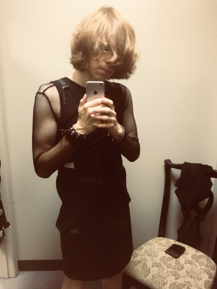 A bit nervous about posting it, but I tried on a neat gothy bondage dress and fishnet top. Stockings or leggings would make it work better, perhaps. But I like it.